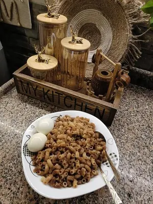 a plate of food with eggs and mushrooms on a counter at الاغوار bb in Khirbat ash Shaykh Muḩammad