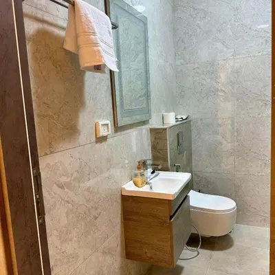 a bathroom with a sink and a toilet at Z villas Chalet in Al Rama
