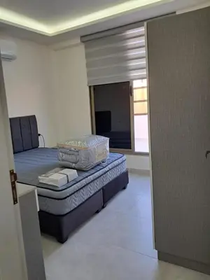 a bedroom with a bed and a window in a room at منزل السعادة in Amman