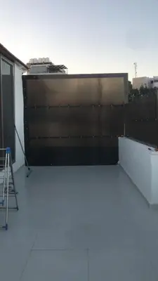 a building with a wall on the side of it at منزل السعادة in Amman