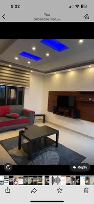 a living room with a couch and a table at Apartment in Al Jafr