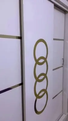 a door with a snake on it next to a window at مليح هوستل