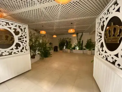 a hallway with potted plants in a building at Sanad Apartment شقة فندقية in Aqaba