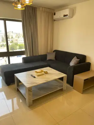 a living room with a couch and a coffee table at 2bedroom aprt at 7th circle f-r4 in Amman
