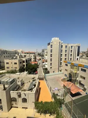 a view of a city with buildings and a street at 2bedroom aprt at 7th circle f-r4 in Amman