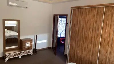 a room with a closet and a mirror and a door at شاليه جبال سوف in Jerash