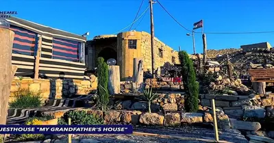 a building with a train in front of a house at بيت جدي in Dana