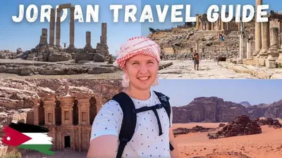 a man standing in front of a temple in the desert at Tourist guide in Al Jafr