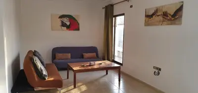a living room with a couch and a coffee table at swahmaya apartments for rent in Sowayma