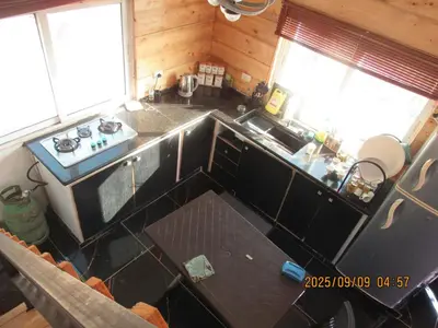 an overhead view of a kitchen with a stove and sink at اكواخ الملول عجلون 1 in ‘Ibbīn