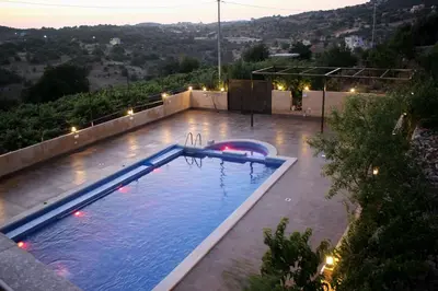 a swimming pool on the roof of a house at Mountain Oak Chalet شالية ملول الجبل in Al Jafr