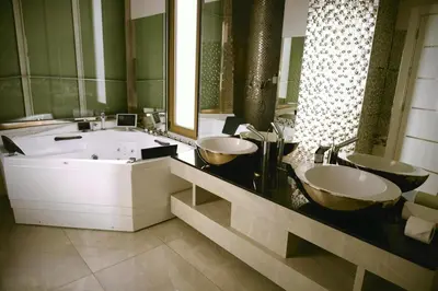 a bathroom with two sinks and a large tub at Luxurious private villa in Mahis in Māḩiş