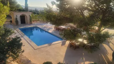 an overhead view of a swimming pool in a backyard at Romana in Ar Rummān