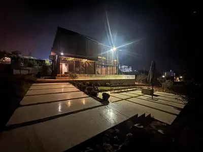 a building with a light on the top of it at night at AlFahed Farm in Ajloun