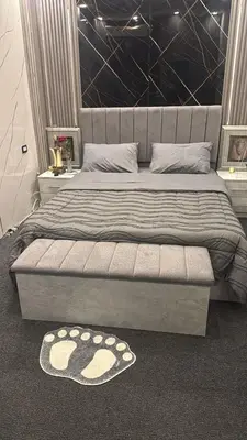a bedroom with a large bed with a large headboard at Studio in the Heart of Irbid in Irbid