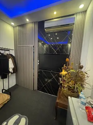 a room with a door with a window and a table at Studio in the Heart of Irbid in Irbid