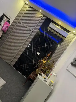 an overhead view of a room with a table with a plant at Studio in the Heart of Irbid in Irbid