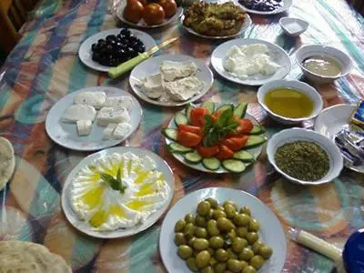a table with plates of food on a table at Studio in the Heart of Irbid in Irbid