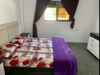 a bedroom with a bed with red roses on it at Enjoy moment chalet