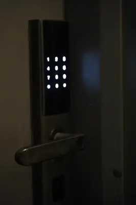a close up of a door with a light in the dark at Luxury Roof-top in Amman