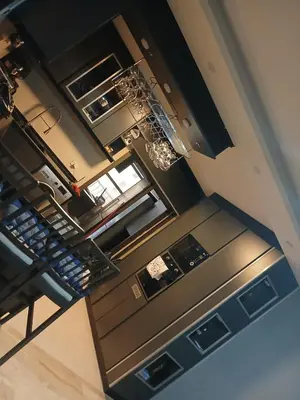 an overhead view of a kitchen with stainless steel appliances at Five-star hotel apartment in Amman