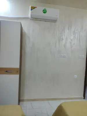 a room with a wall with a air conditioner on the wall at Ayla Furnished Apartments in Aqaba
