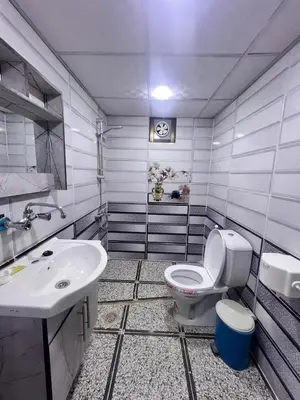 a bathroom with a toilet and a sink at Layla Wadi Rum in Disah