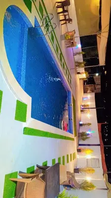 a painting of a swimming pool on the wall of a building at Grand farm
