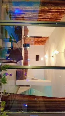 a view of a room through a glass window at Grand farm
