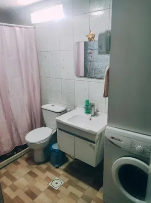 a bathroom with a sink and a toilet and a mirror at الدوار السابع in Amman