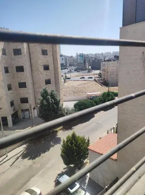 a view of a city street from a building at الدوار السابع in Amman