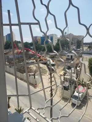 a view of a construction site from a window at Dream Home furnished Apartment in Amman