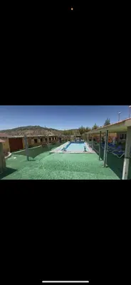 a picture of a swimming pool in a building at شاليهات تلال اشتفينا in Ajloun