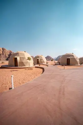 a row of tents in the middle of the desert at Terra Nova Camp in Wadi Rum