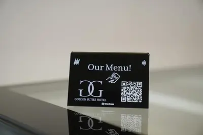 a box of our menu on a glass table at Golden Suites Hotel in Amman