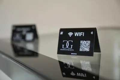 a close up of a remote control in a machine at Golden Suites Hotel in Amman