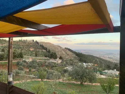 a view from a room with a view of a mountain at شاليه بانا جرش in Jerash