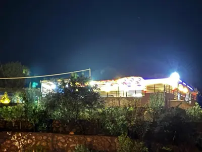 a building at night with lights on it at شاليه بانا جرش jerash