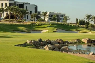 a golf course at the resort with a hole at Cozy Apartment with Private Beach, couples and families only in Aqaba