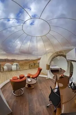 a room with a ceiling with a painting of a bedroom at Desert rose in Al Jafr