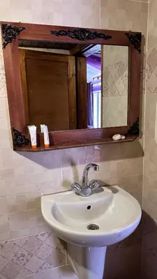 a white sink in a bathroom with a mirror at Sultan rum magic camp in Aqaba