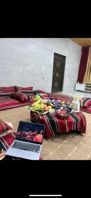 a laptop computer sitting on top of a bed at Moose house in Ajloun