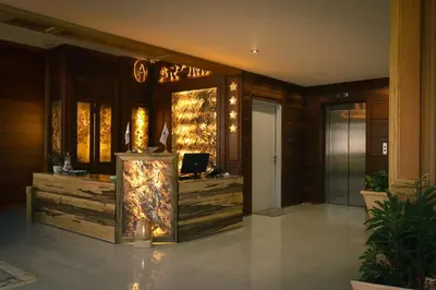 a lobby with a desk with a computer in it at Aroma Hotel in Aqaba