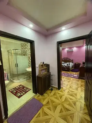 a room with a room with a shower and a bedroom at Luxury couple room in irbid in Irbid