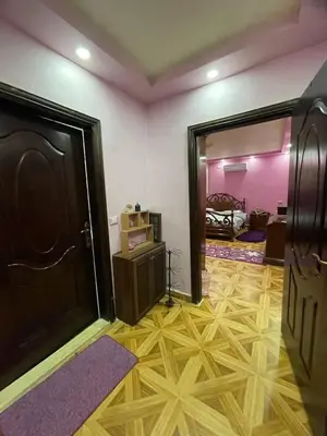 a room with a door and a bedroom with a bed at Luxury couple room in irbid in Irbid