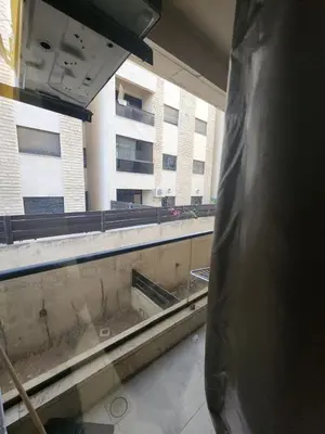 a view from a window of an empty building at Family apartment in Abdoun Al Janobi in Amman