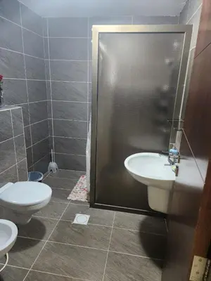 a bathroom with a toilet and a sink at 4th circle embassy district 2 bedrooms الدوار الرابع حي السفارات in Amman