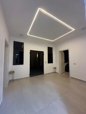 a large white room with a large ceiling at Hassan villa in Sākib