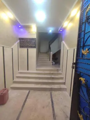 a staircase in a building with a sign on it at المناخير هوستل in Amman