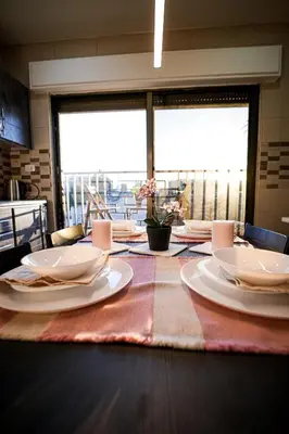 a dining room table with plates on top of it at Apartment in Amman 7th Circle near Cozmo market in Amman